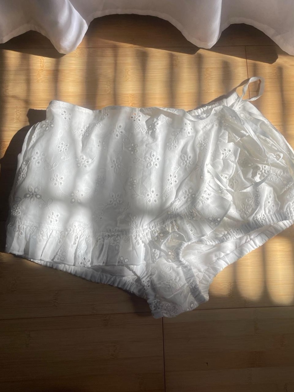 Frankie’s bikinis x Bella Hadid White Eyelet Ruffle Skort